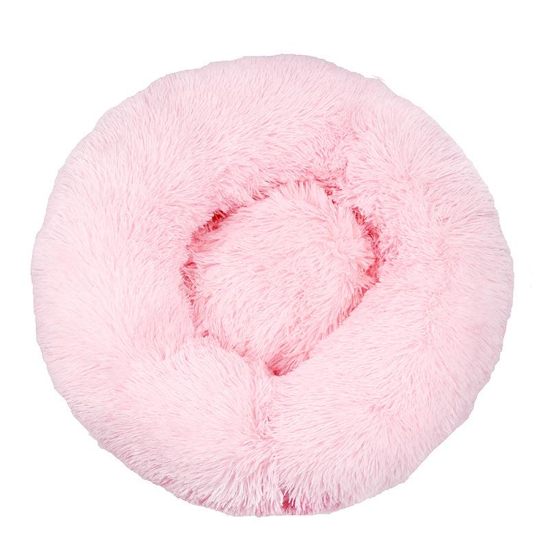 Cream colored plush cat bed, perfect for small pets seeking warmth and security