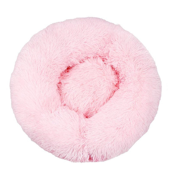 Cream colored plush cat bed, perfect for small pets seeking warmth and security
