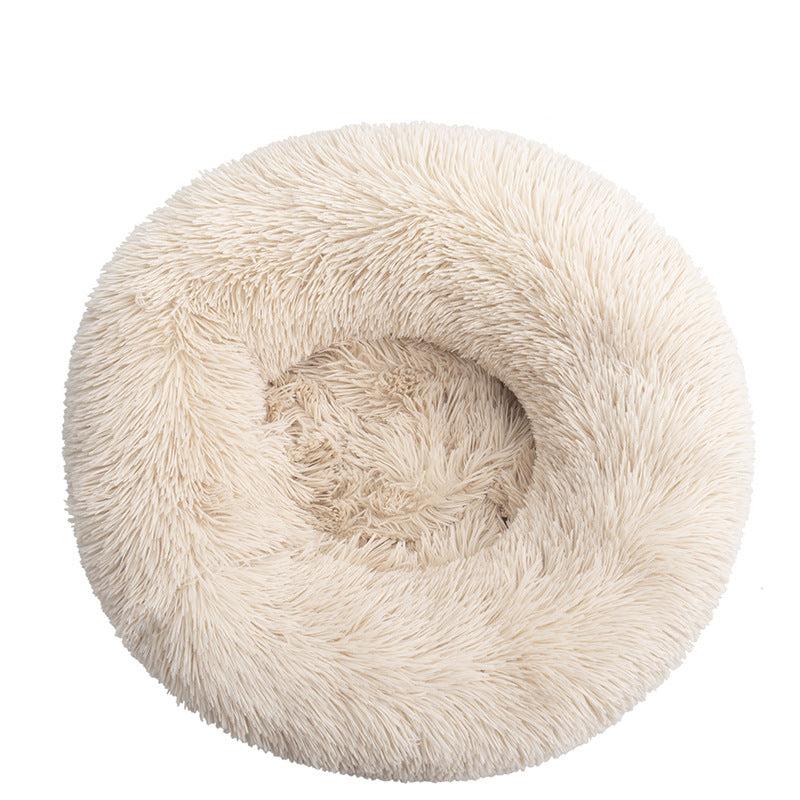 Close-up of fluffy texture of a unisex calming cat bed, promoting deep sleep