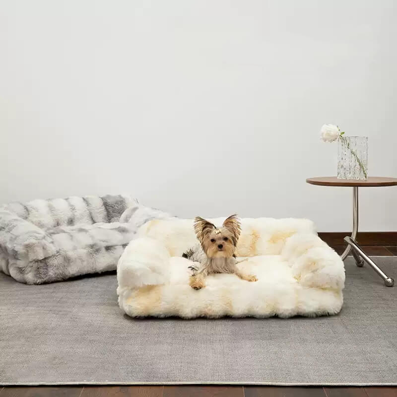Plush round pet bed in gray, designed for calming dogs and cats, soft anti-anxiety pet furniture.