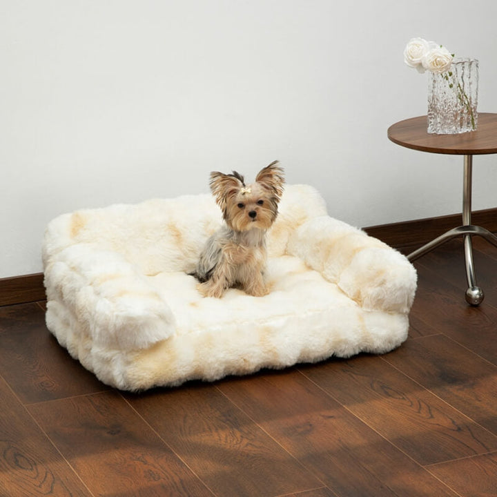 Beige calming pet sofa bed, cozy and washable, for small to medium dogs and cats.