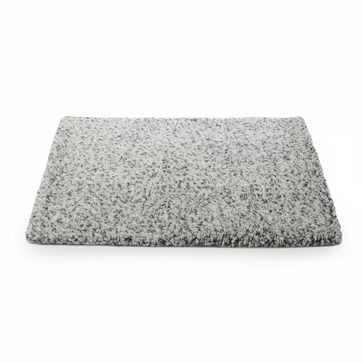 Plush self-heating pet mat providing cozy comfort for cats and dogs, machine washable sleep pad.
