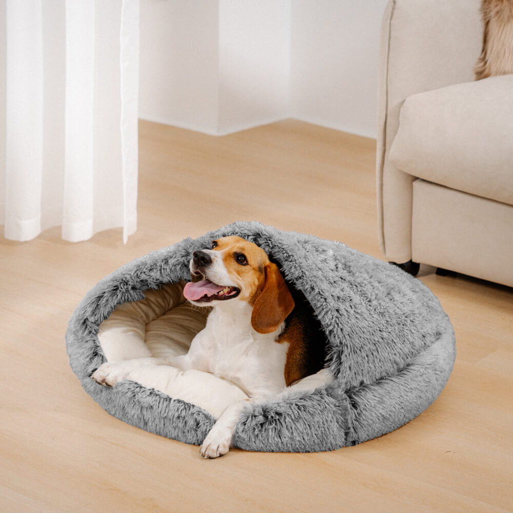 Semi-enclosed dog bed in a neutral tone, providing a calming and soft pet nest for relaxation.