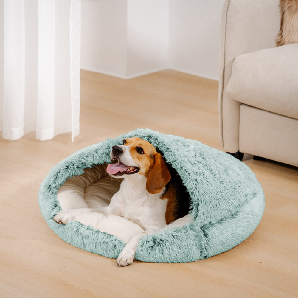 Illustration of a happy dog resting in the plush, washable, semi-enclosed calming pet bed.