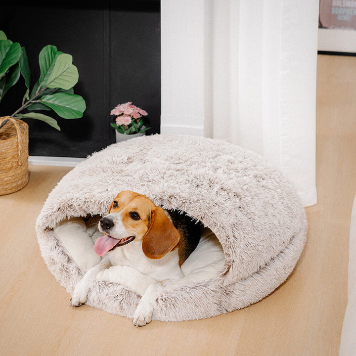 Top view of the calming dog bed, revealing the nest-like structure and generous padding.