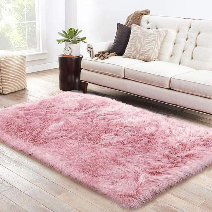 Bedroom area rug, soft faux wool shag in light grey, enhancing decor