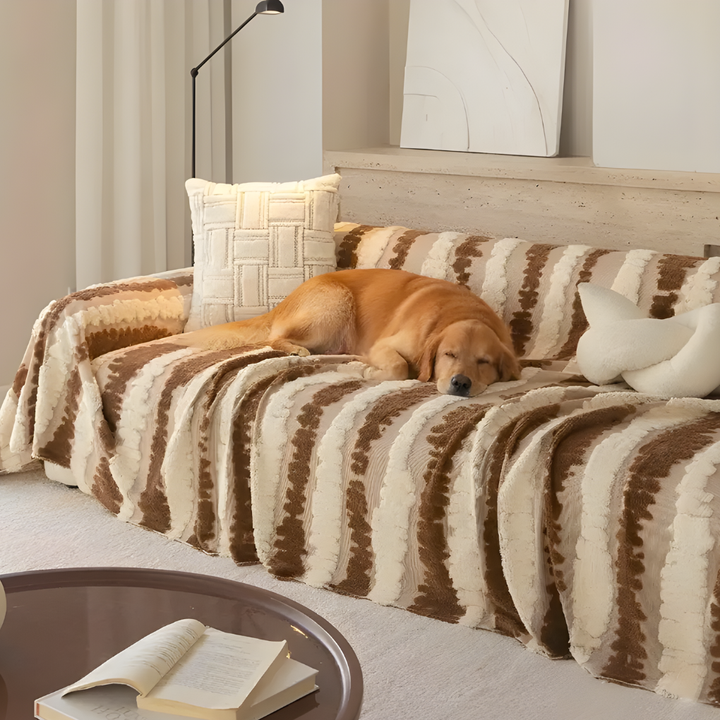 Plush sofa blanket cover in a neutral tone, protecting a living room couch, pet-friendly home decor.
