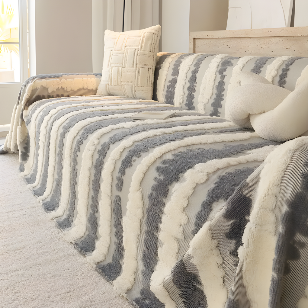 Soft, non-slip plush sofa blanket draped over a "New4" type sofa, multi-functional furniture protector.