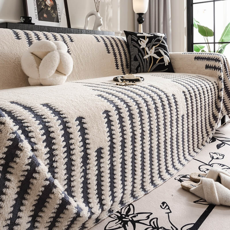 Elegant plush couch cover fitting snugly on a sofa, enhancing home decor with full coverage protection