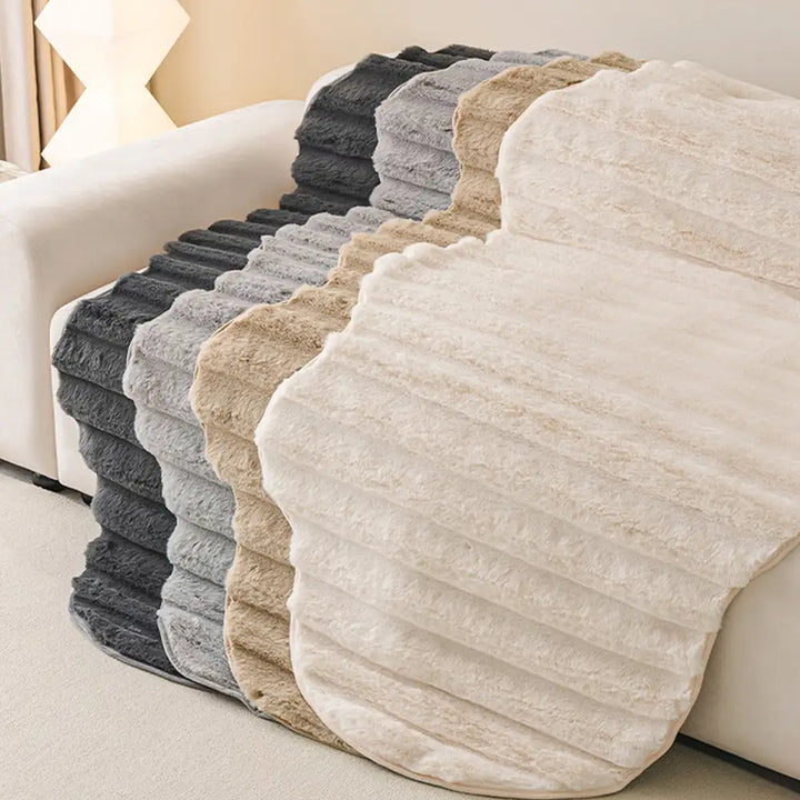 Full view of a living room with a plush sofa cover, creating a pet-safe space.