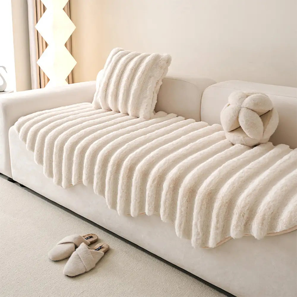 Angled shot of a plush sofa cover, illustrating its snug fit and protective qualities.