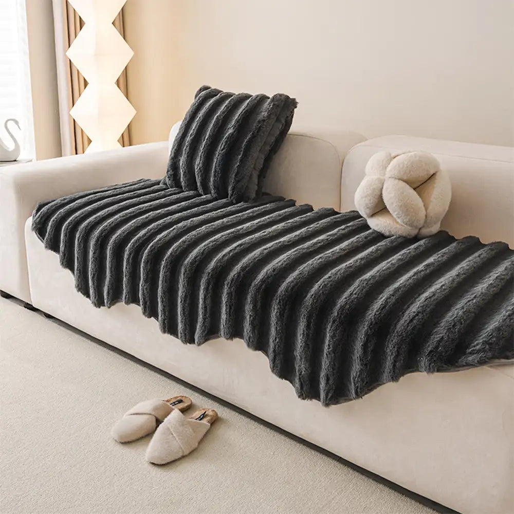 Machine washable plush sofa cover, offering easy care for pet owners.