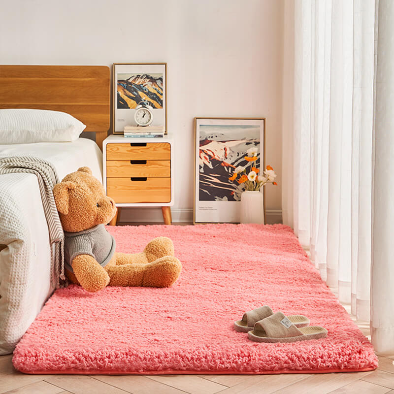 High-angle view of a large blue shaggy area rug in a bedroom, soft non-slip and plush floor carpet.