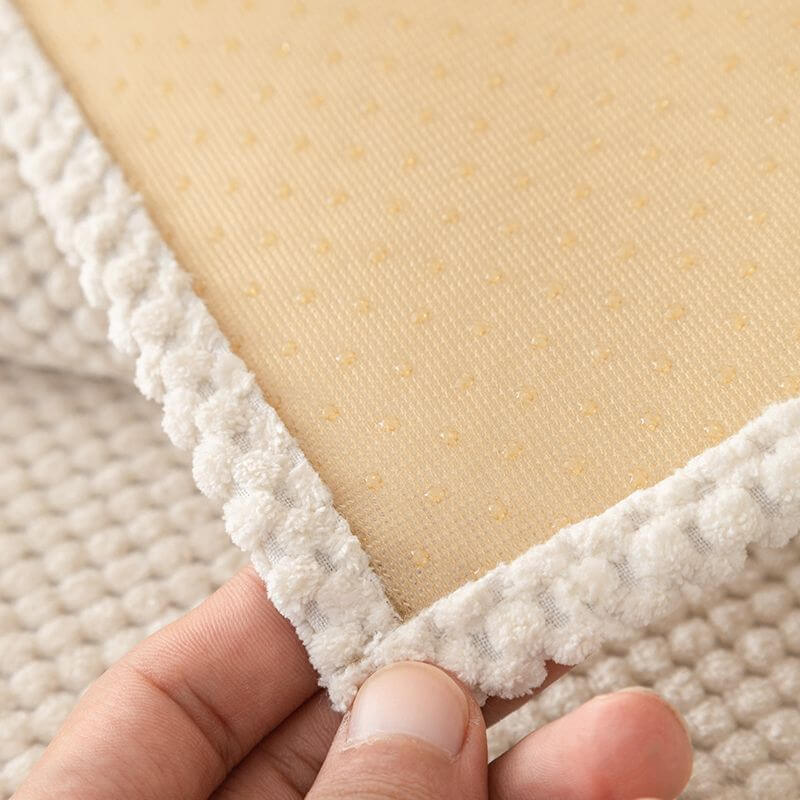 Plush solid color sofa cover transforming an old couch into a refreshed piece of home decor