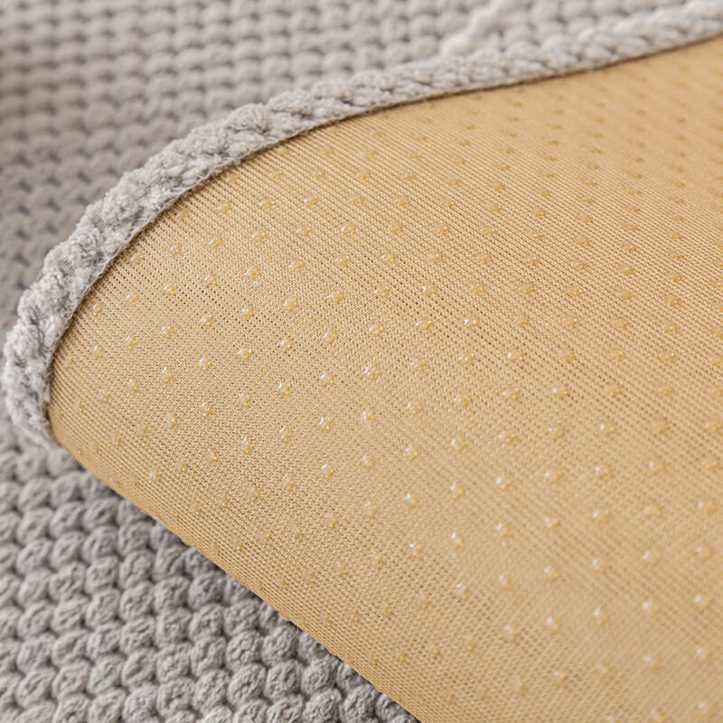 Corner detail of a sectional sofa with a plush solid color cover, enhancing home decor