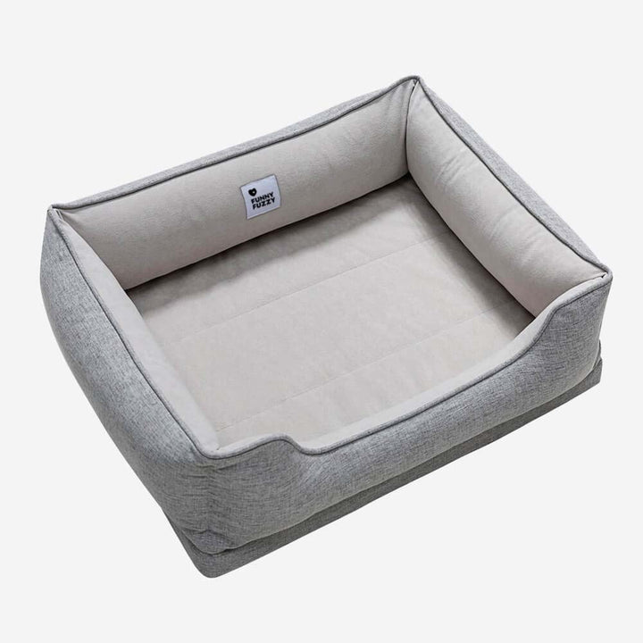 Plush square dog bed in 'bread' style, ensures pet comfort and warmth.