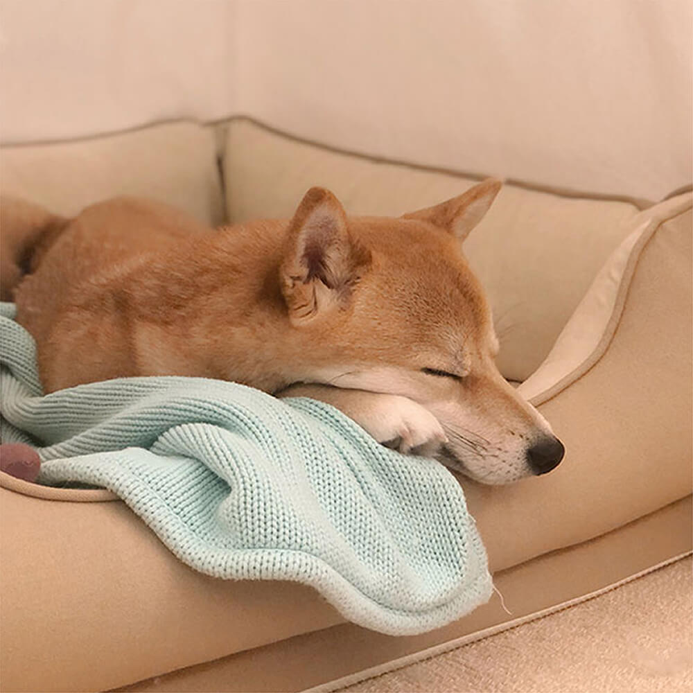 Closeup of the plush texture of a square bread dog bed, ideal for small pets.