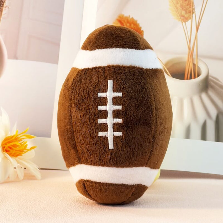Brightly colored squeaky dog toy in a football design, great for chewing and pet enrichment.