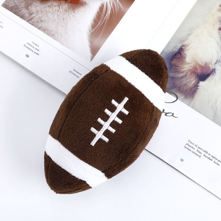 Soft but durable squeaky rugby toy for dogs, ideal for interactive play and strong chewers.