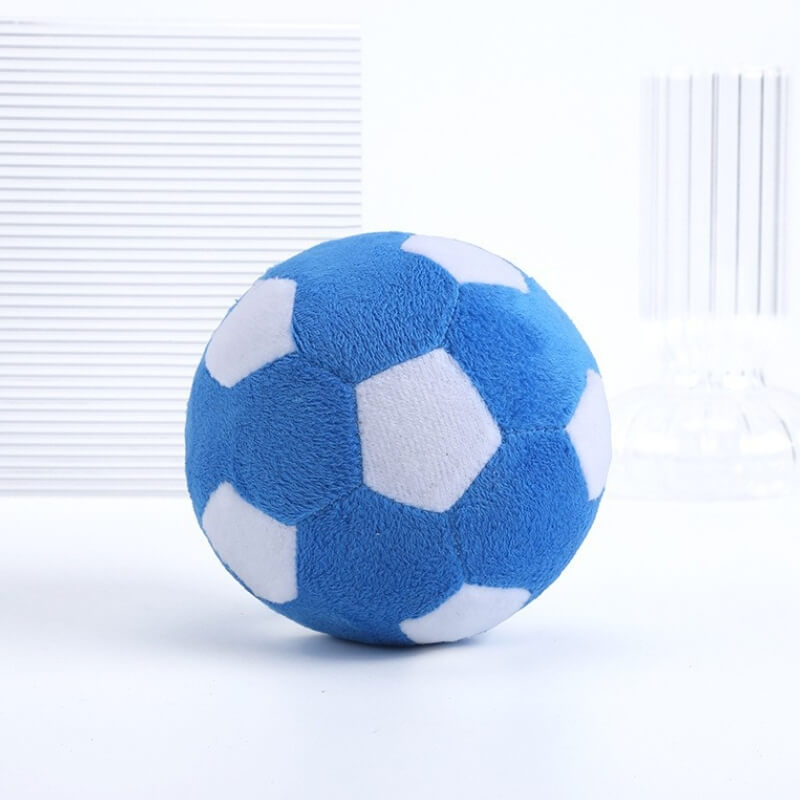 Dog enrichment plush squeaky football toy, excellent for chewing and promoting dental health.