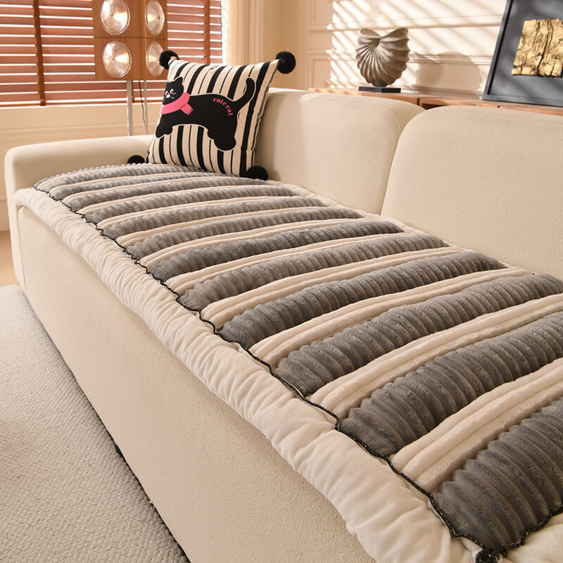 Close-up of the soft plush fabric and striped pattern of a non-slip pet-friendly couch cover.