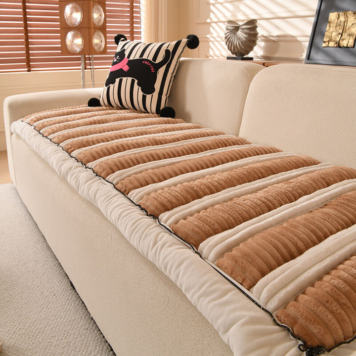 Texture shot of the plush striped fabric on a durable pet-friendly furniture protector for sofas.