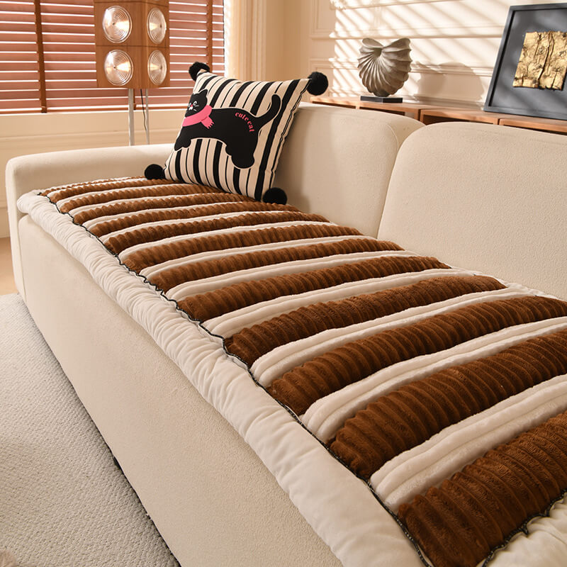 Non-slip striped couch cover in a neutral color, enhancing living room aesthetics while protecting furniture.