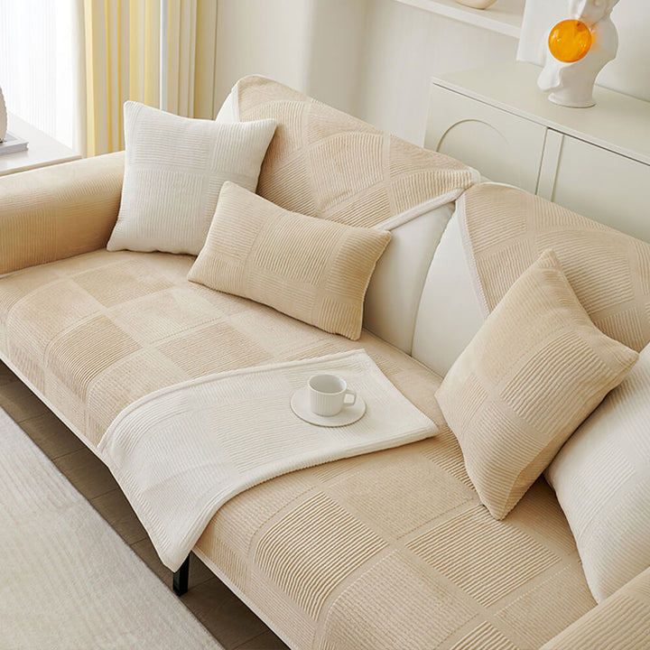 High-angle view of a plush striped square couch cover covering an L-shaped sectional.