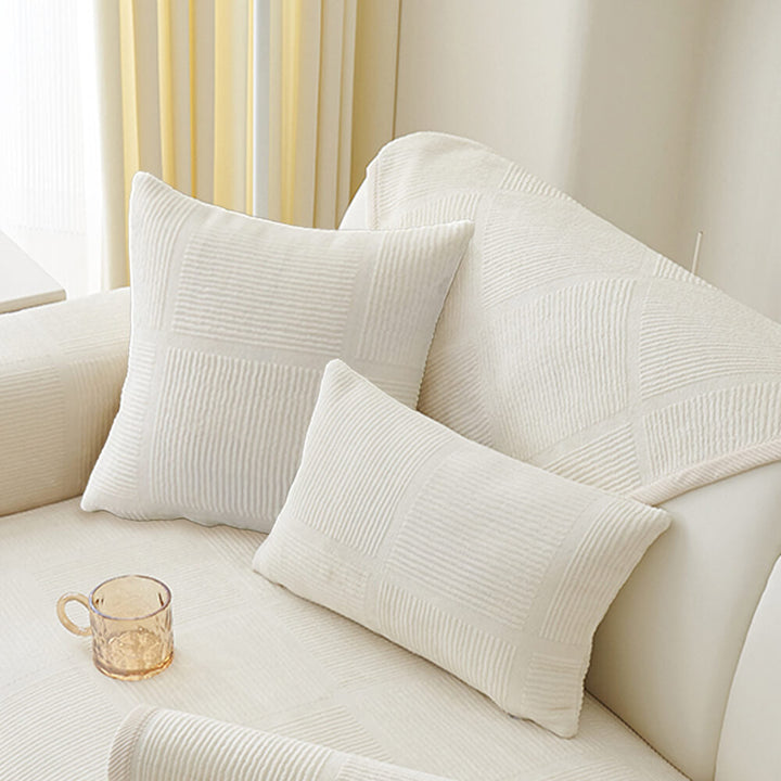 A child playing on a plush striped square couch cover, durable and easy to clean.