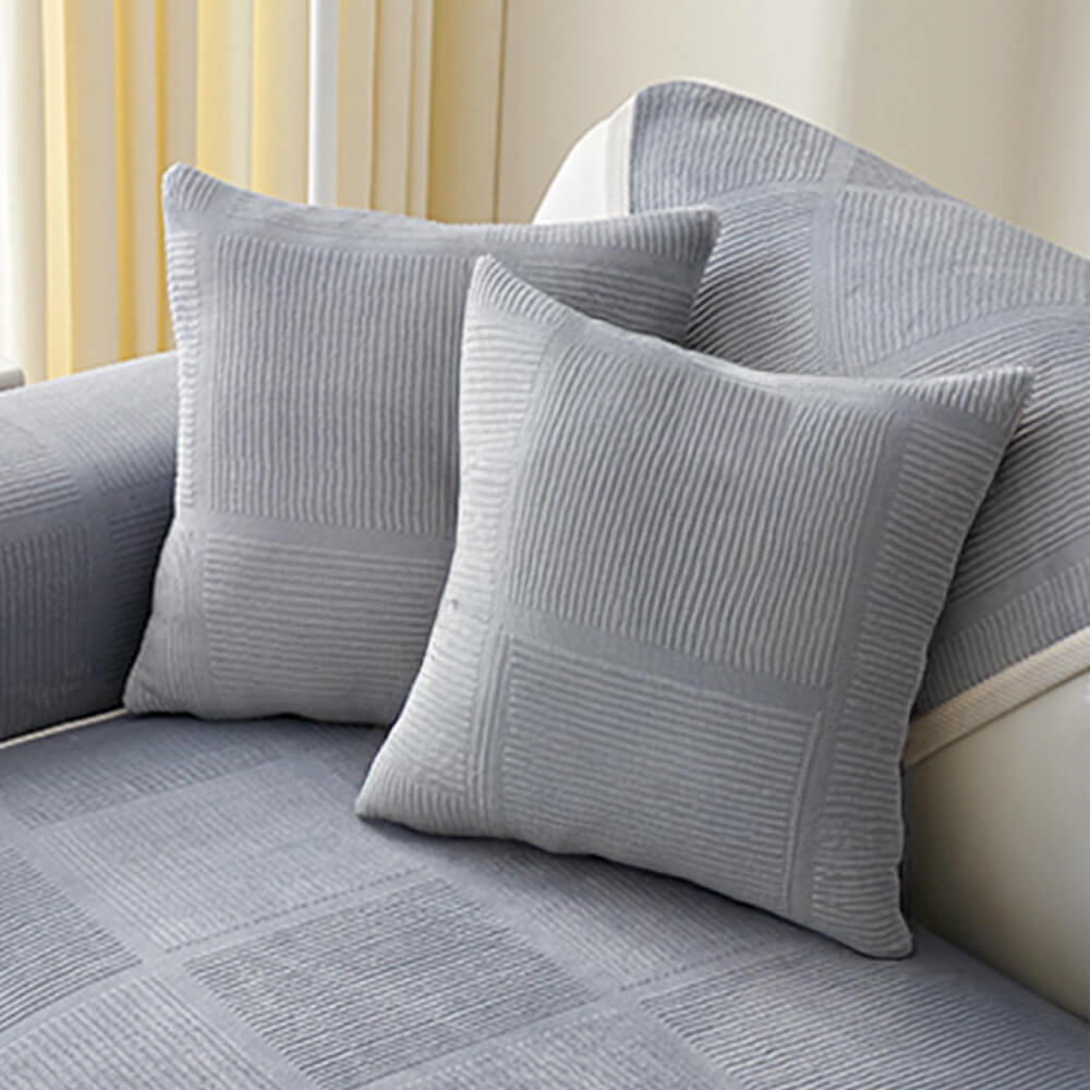 Folded plush striped square couch cover, showing its thick and soft texture.