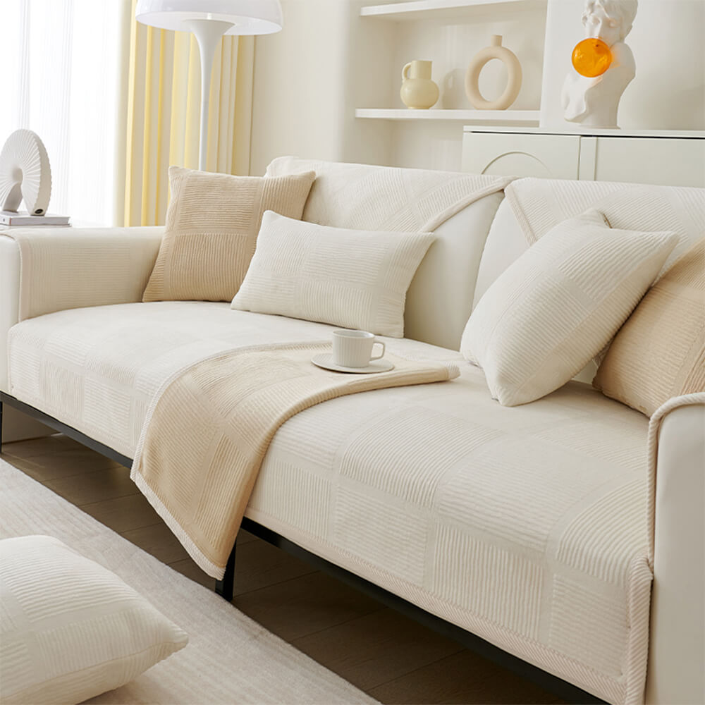 Close-up of the plush fabric and striped pattern on a square couch cover for home decor.