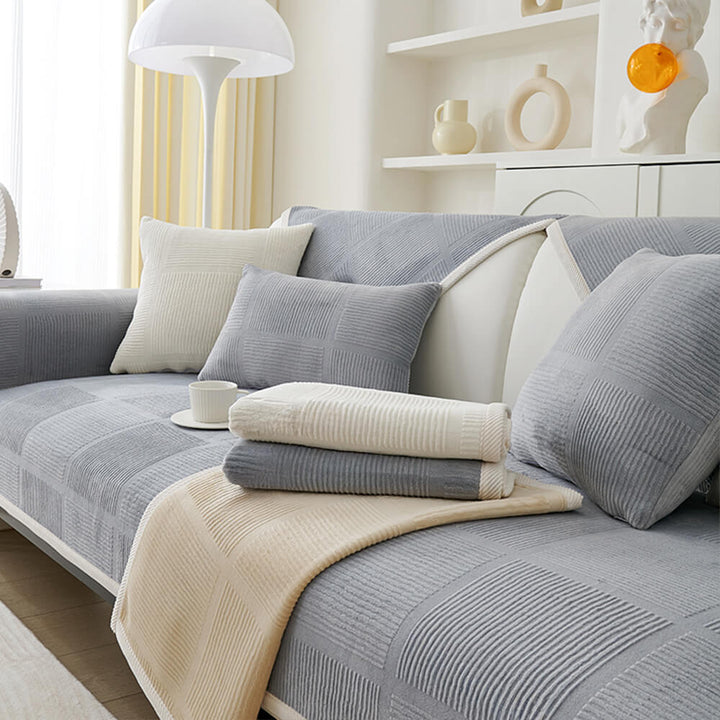 Easy-clean plush striped square couch cover, protecting a sofa from pets and spills.