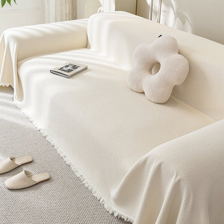 Full view of a waterproof teddy plush couch cover on a 3-seater sofa
