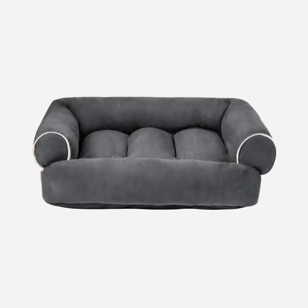 Dog bed, U-shaped and plush, providing cozy pet comfort with a removable cover