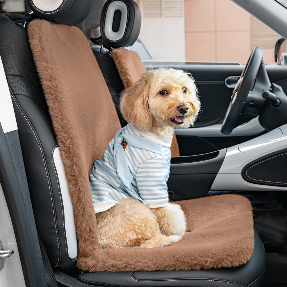 Detail of secure straps on a universal plush dog car seat cover, easy installation, machine washable.