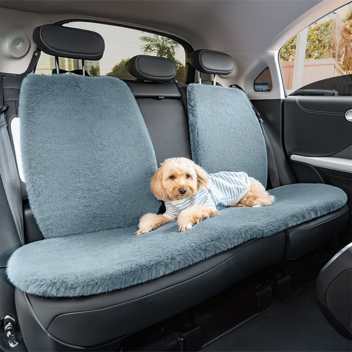 Dog enjoying travel in a plush, comfortable universal car seat cover, clean vehicle interior.