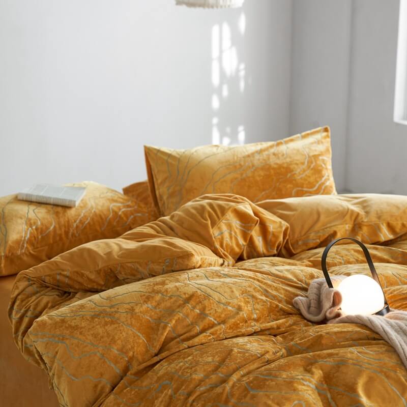 Complete velvet anti-static suede bed sheet set on a mattress, cozy bedroom feel