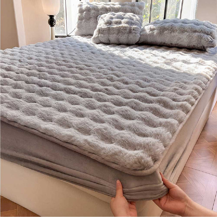 Plush velvet fitted sheet in a cozy bedroom setting, includes matching pillowcases, pet hair resistant bedding.