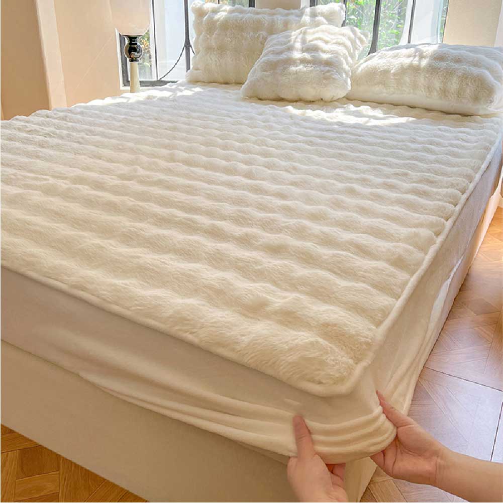 Cozy bedroom setting with a plush bubble fitted sheet and matching pillowcases, emphasizing comfort and home decor.