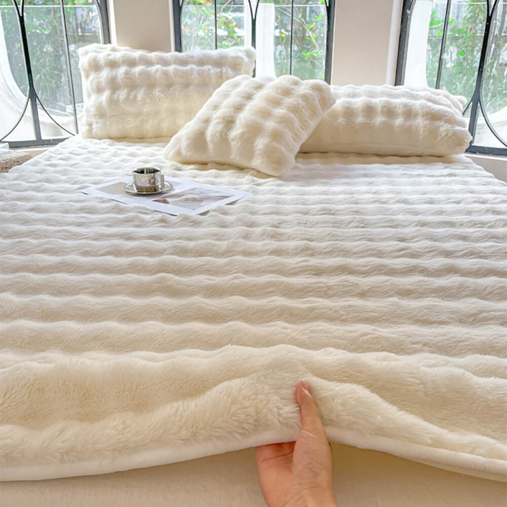 Soft bubble texture plush fitted sheet in a neutral color, perfect for a cozy bedroom, includes pillowcases.