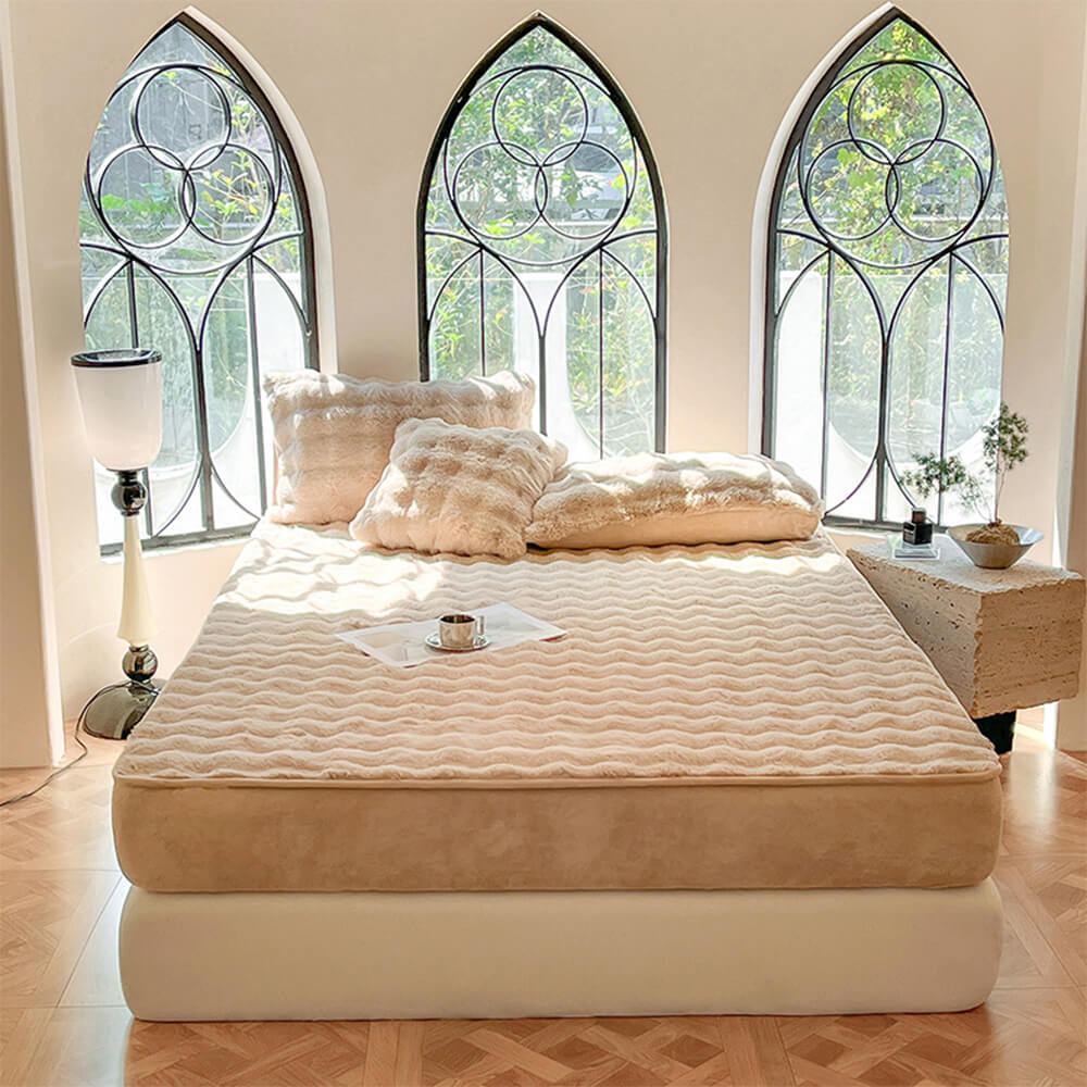 Bed showcasing a fitted velvet mattress cover with matching plush pillowcases, cozy and pet hair resistant.