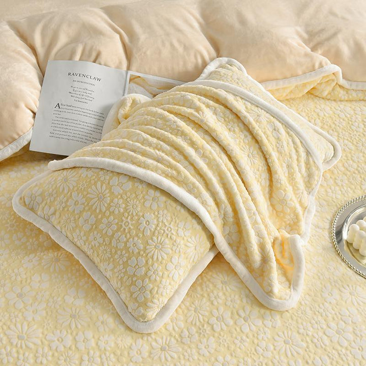 Full view of a bed styled with a velvet floral carved bedding set, inviting and luxurious