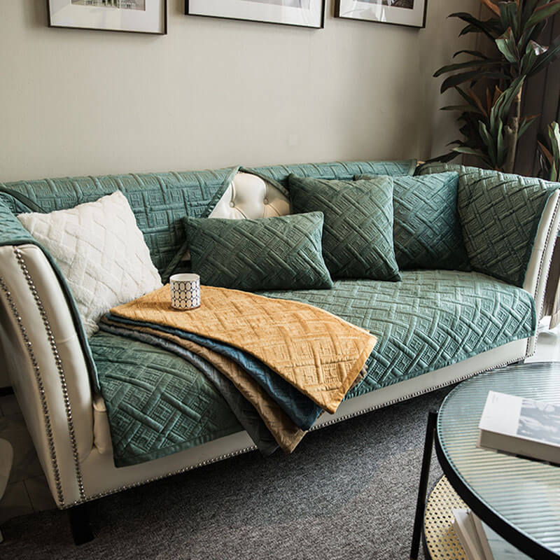 Sofa protector in velvet, showcasing its slip-resistant backing and elegant home decor aesthetic.
