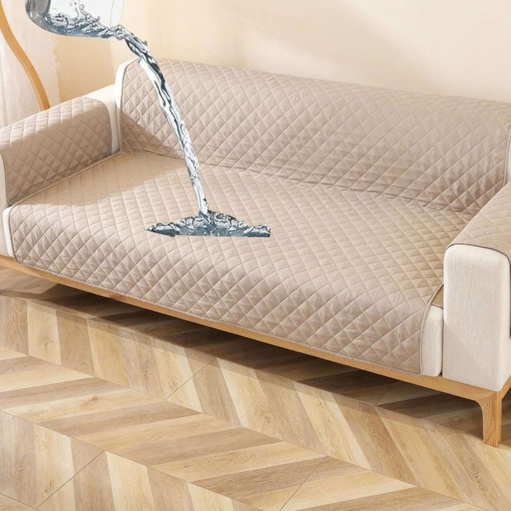 Packaging shot of a new velvet waterproof sofa cover, emphasizing non-slip and machine washable features.