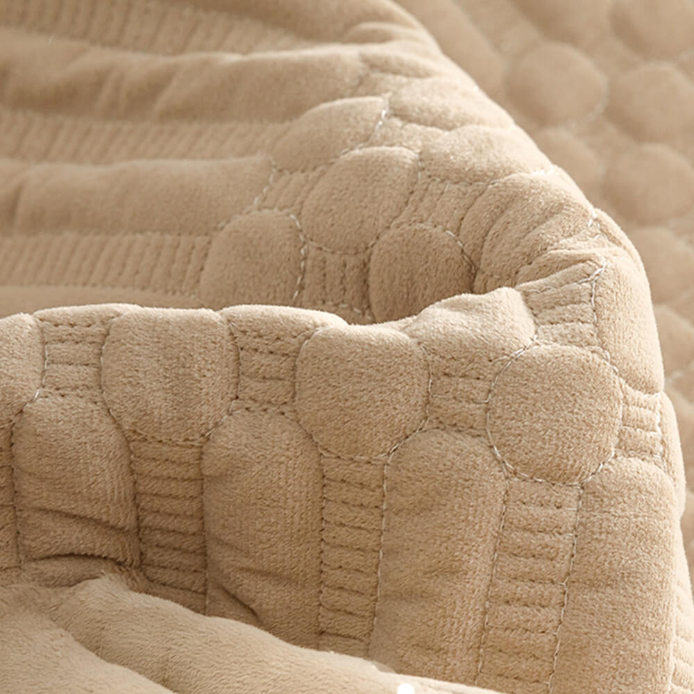 Plush vintage couch cover draped over a sofa, showcasing its non-slip effectiveness