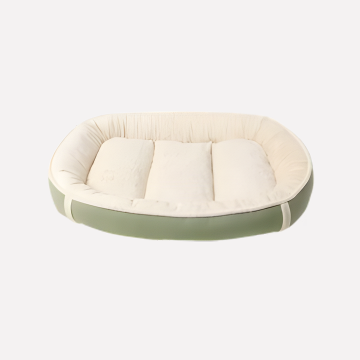 Plush washable nest dog bed with raised edges in a living room, providing cozy comfort for pets.