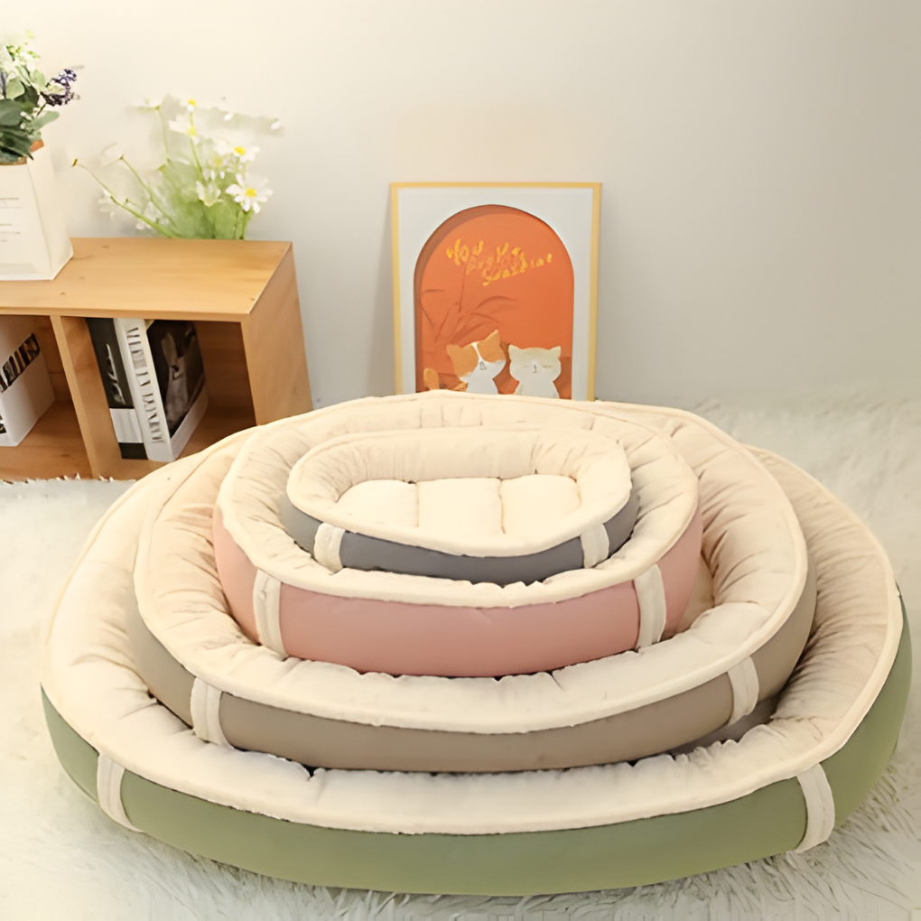 New4 washable nest dog bed with raised walls, providing a secure and comfortable spot for dogs to rest.