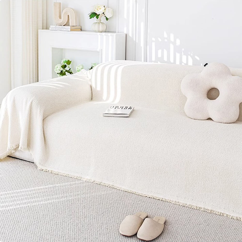 Dark brown plush sofa protector, water-resistant couch cover made of durable polyester material.