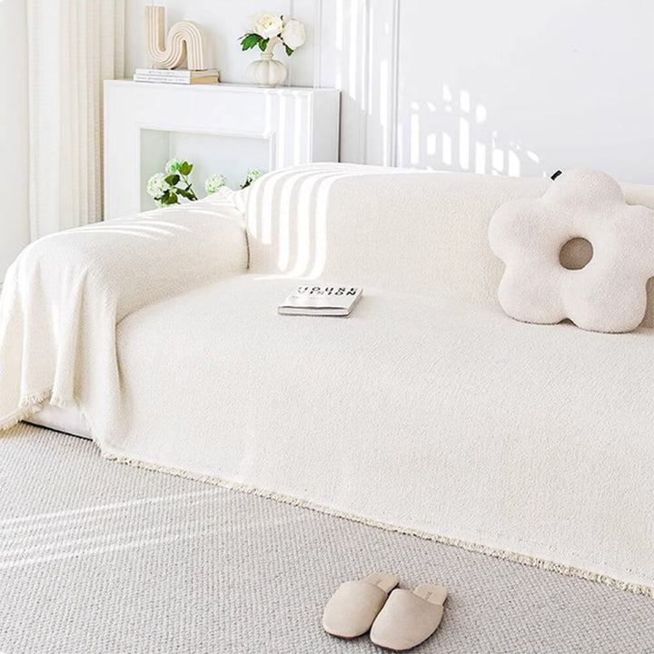Dark brown plush sofa protector, water-resistant couch cover made of durable polyester material.