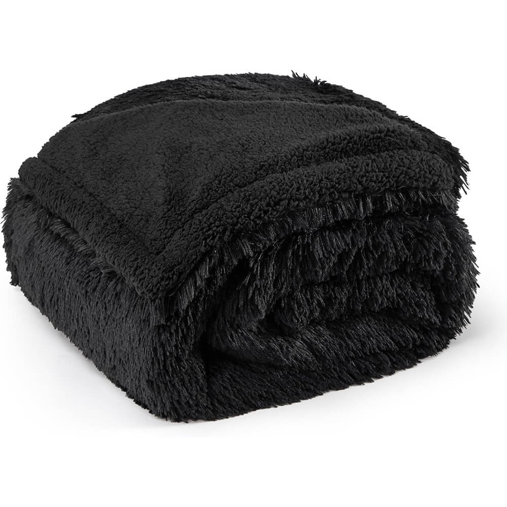 Waterproof dog blanket acting as animal bedding, keeping a dog crate warm and clean